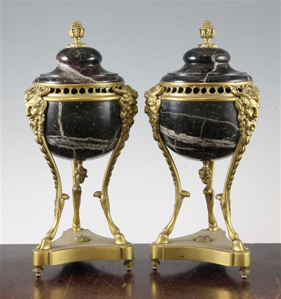 A pair of French Empire style marble and ormolu lidded urns, 11in.